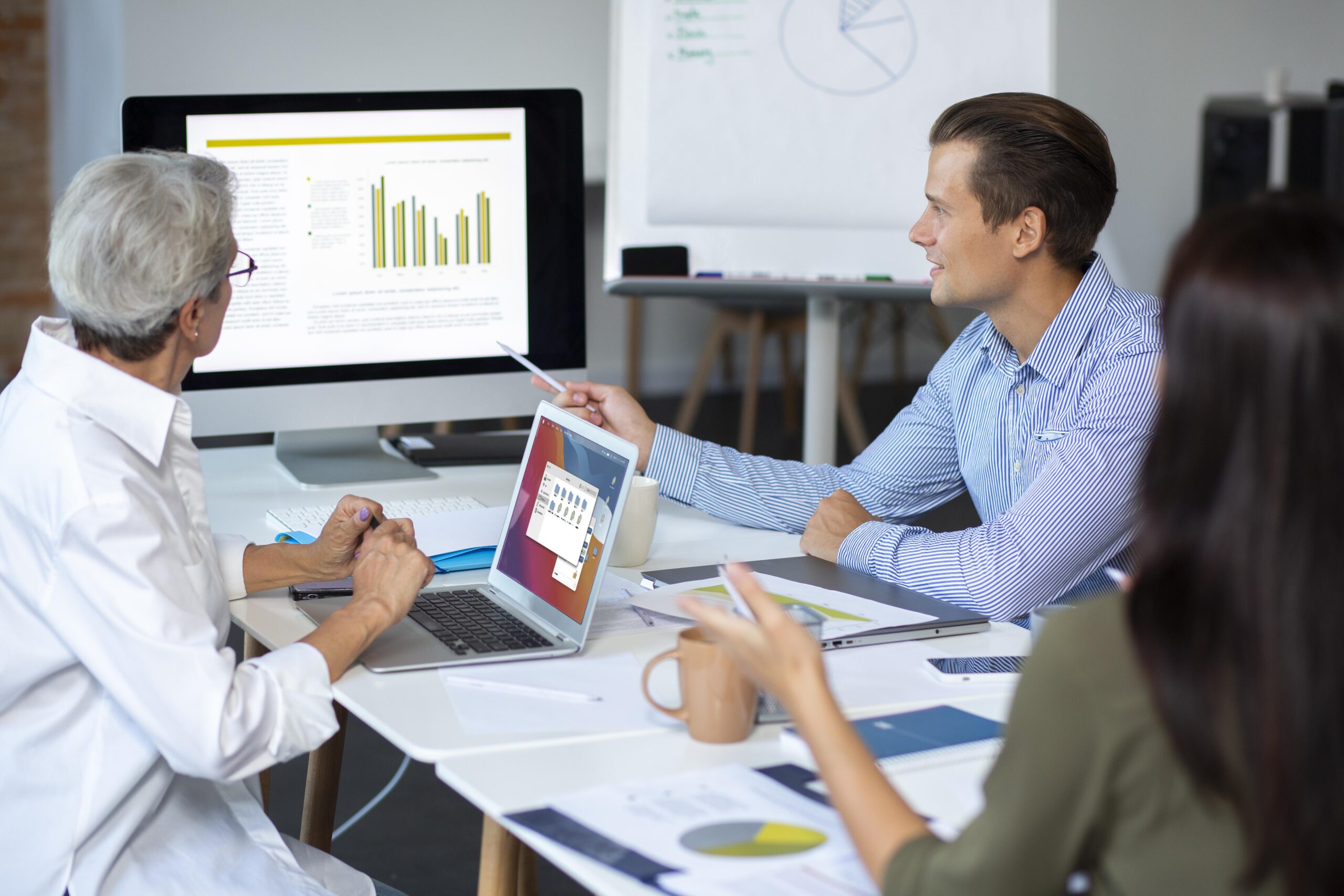 people-using-digital-device-while-meeting